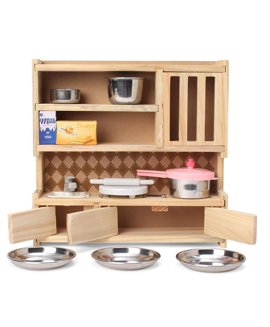 Wooden play kitchen set with metallic pots and pans on a white background