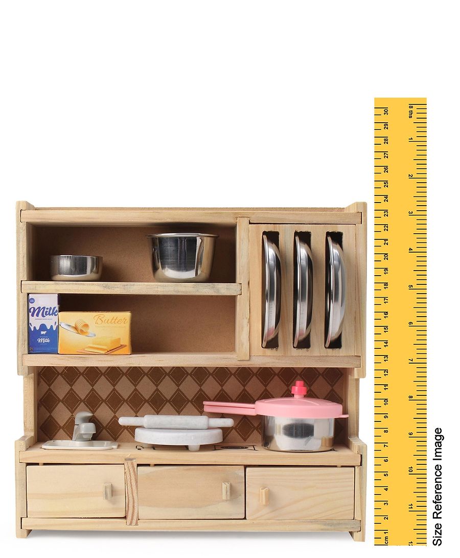 Wooden toy kitchen set with shelves, drawers, and utensils, accompanied by a ruler for scale.