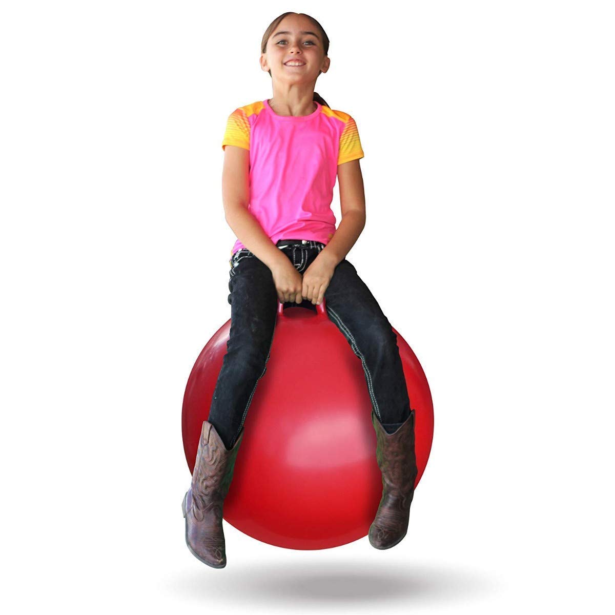Girl sitting on a red exercise ball against a white background