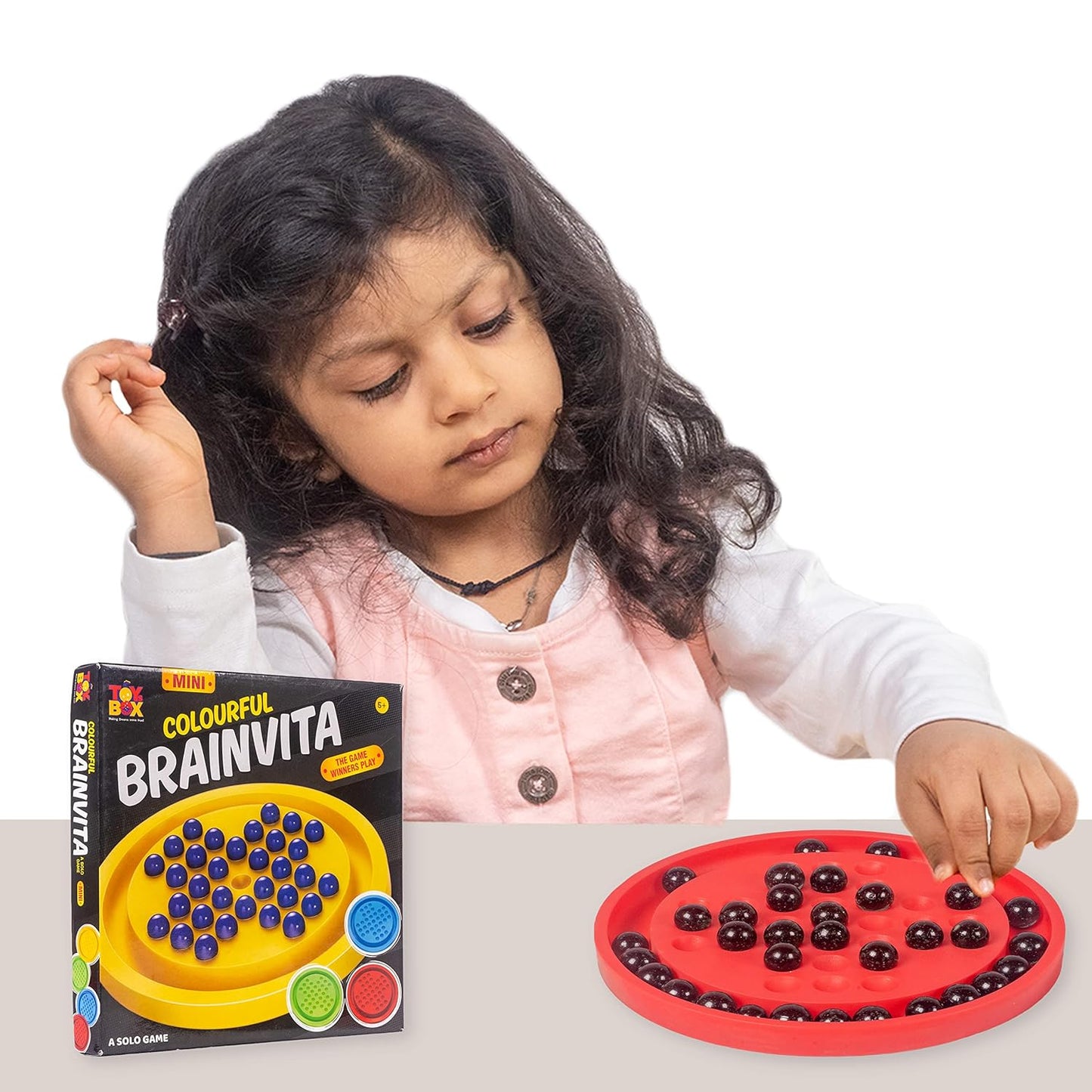 Child playing with a colorful brain training game