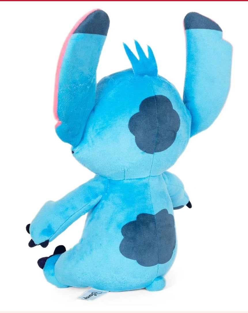 Blue plush toy with black spots on a white background