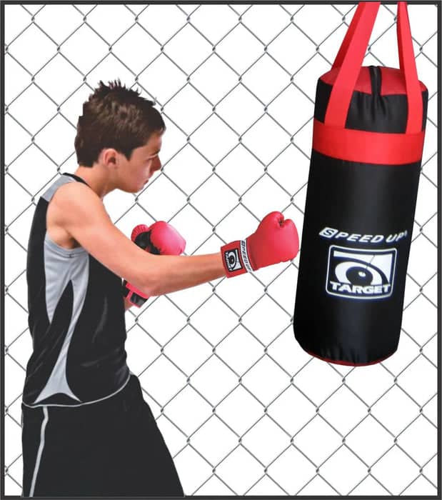 Person wearing boxing gloves and punching a black and red punching bag with 'Speed Up' branding.