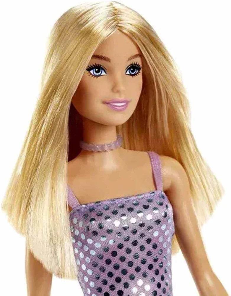 Barbie doll with glitter dress wearing a purple sparkly outfit and long blonde hair