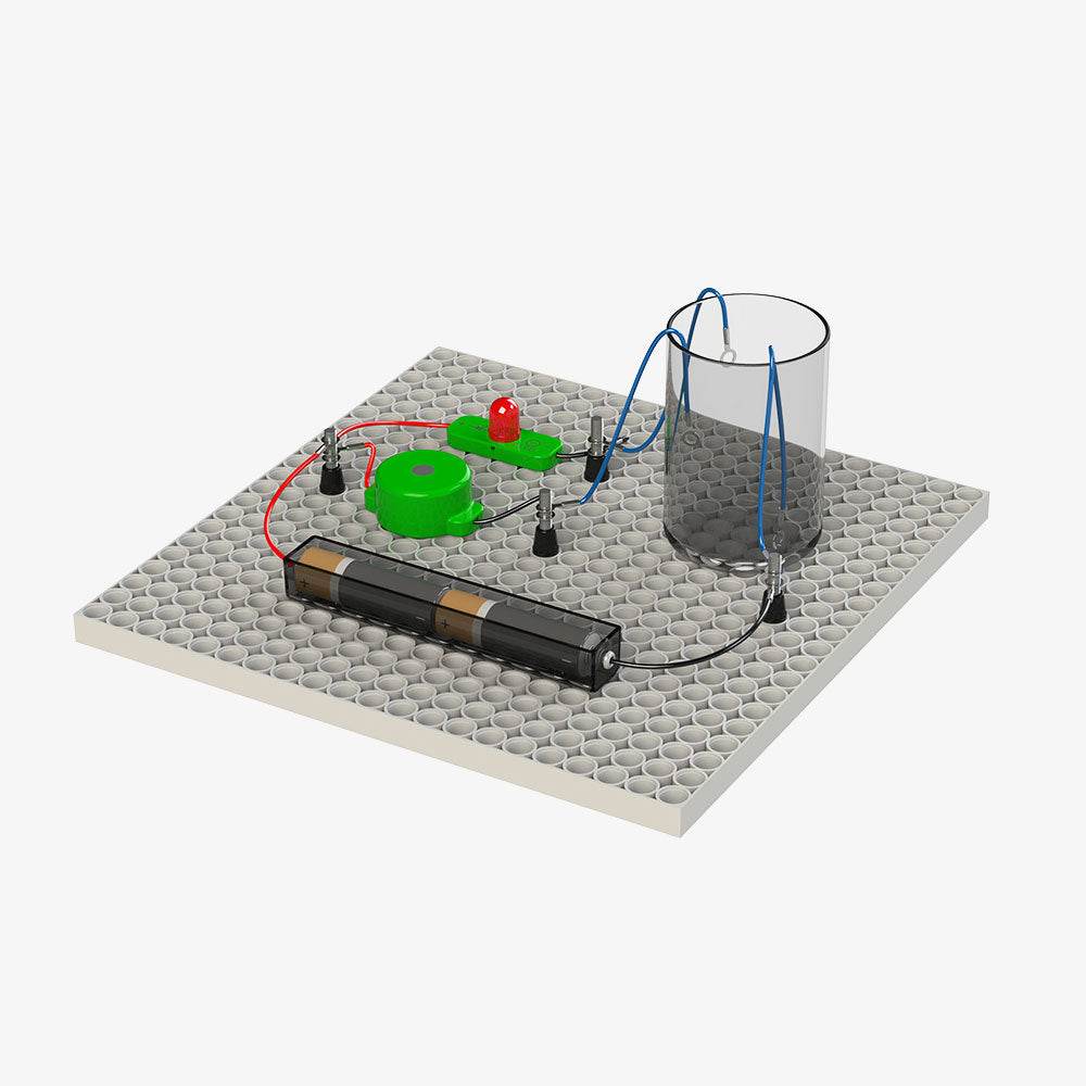 Educational construction toys for children with battery pack, wires, LED, and conductive components on a gray base