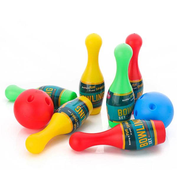 Colorful bowling pin set up for kids, featuring red, green, and yellow pins with playful design