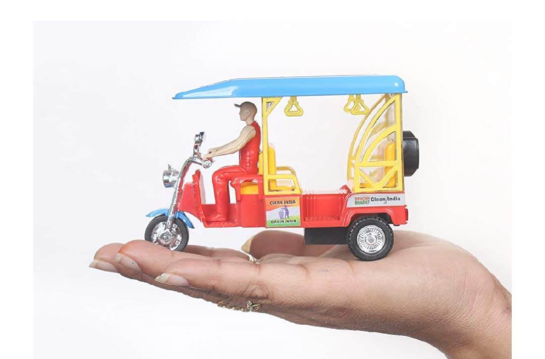 Centy Toys e rickshaw toy blue and red with driver figure held in hand