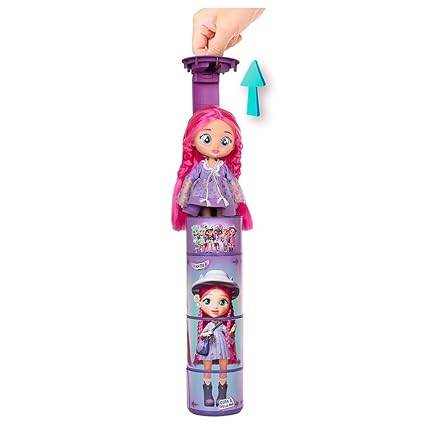 Cry Babies BFF Katie fashion doll with pink hair and purple outfit packaged in a pull-up display tube