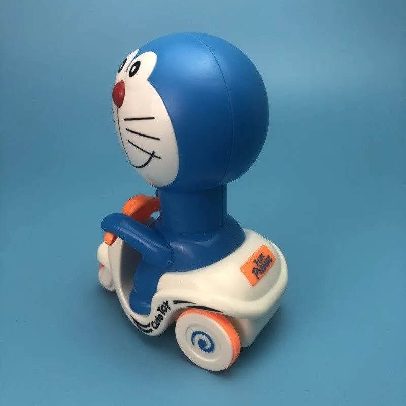 Doraemon push and go toy in blue and white with orange wheels on a blue background