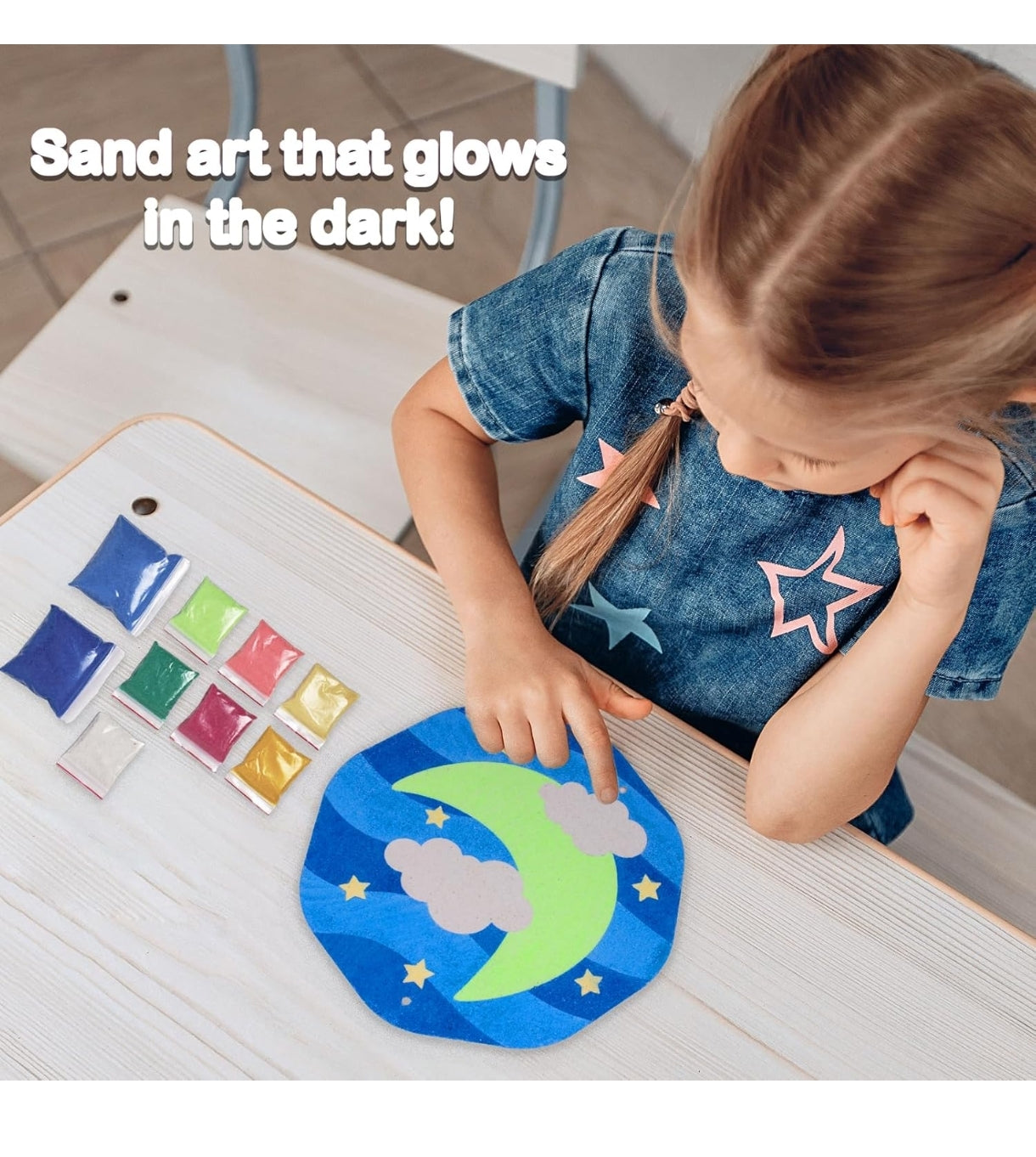 Child using Funskool Twilight Treasures DIY craft set to create glowing sand art with moon and stars design