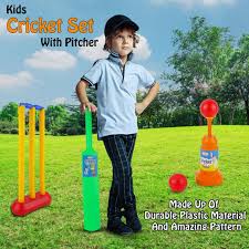 Children's cricket set with pitcher on a grassy field
