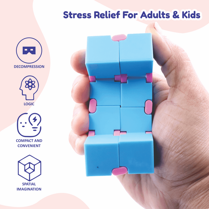 Hand holding a blue and pink Infinity Cube fidget toy for stress relief and brain logic