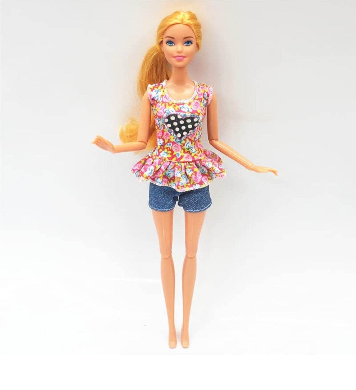 Kiara fashion doll for kids with blonde hair wearing floral top and denim shorts