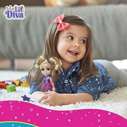 Happy little girl playing with preschool ballerina doll for girls wearing a pink tutu and golden hair buns