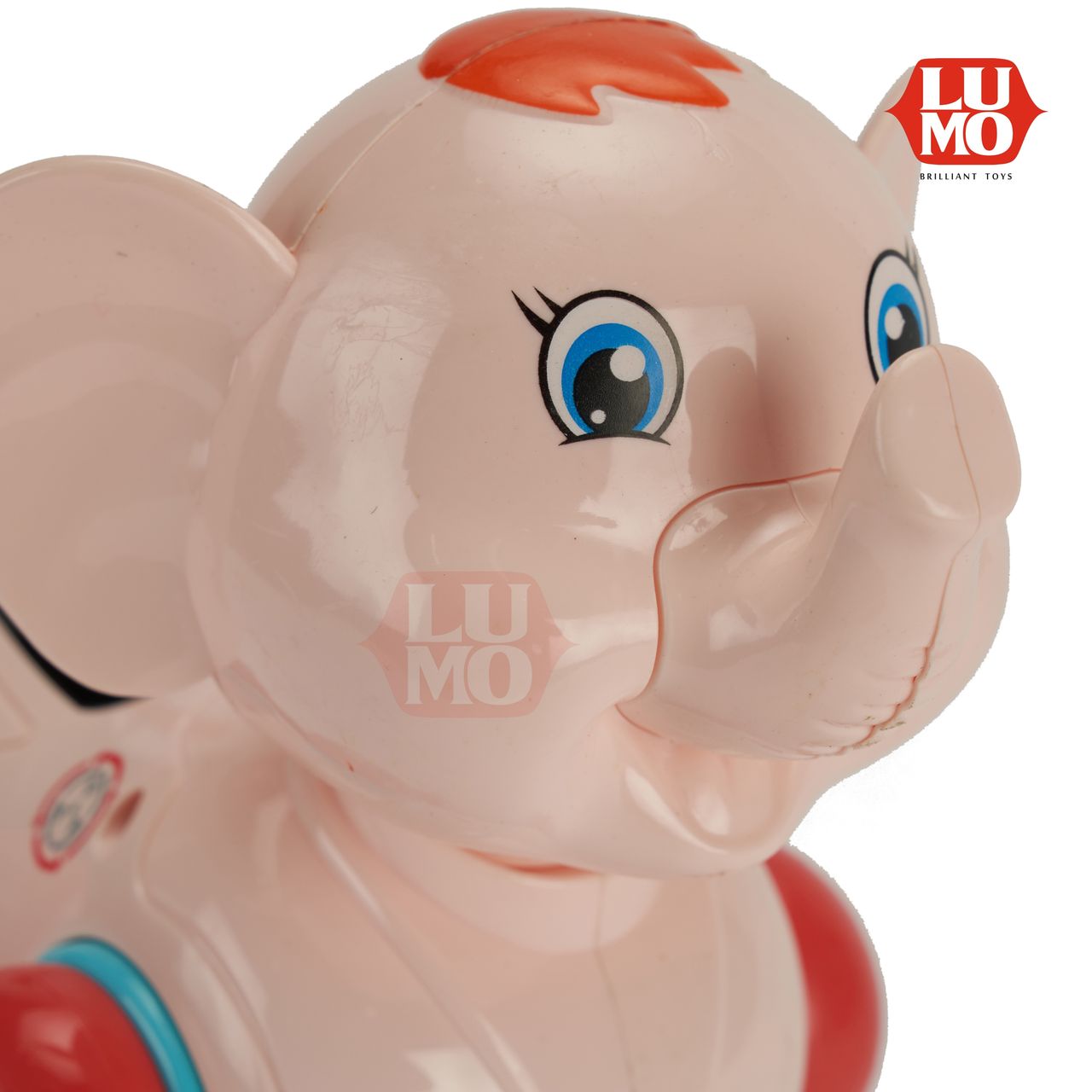 Close-up of Lumo Machine Elephant toy with blue eyes and orange hair by LUMO musical toy