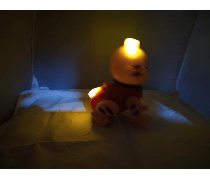 Lumo musical jumping tiger toy glowing in dark with yellow light on tiger figure