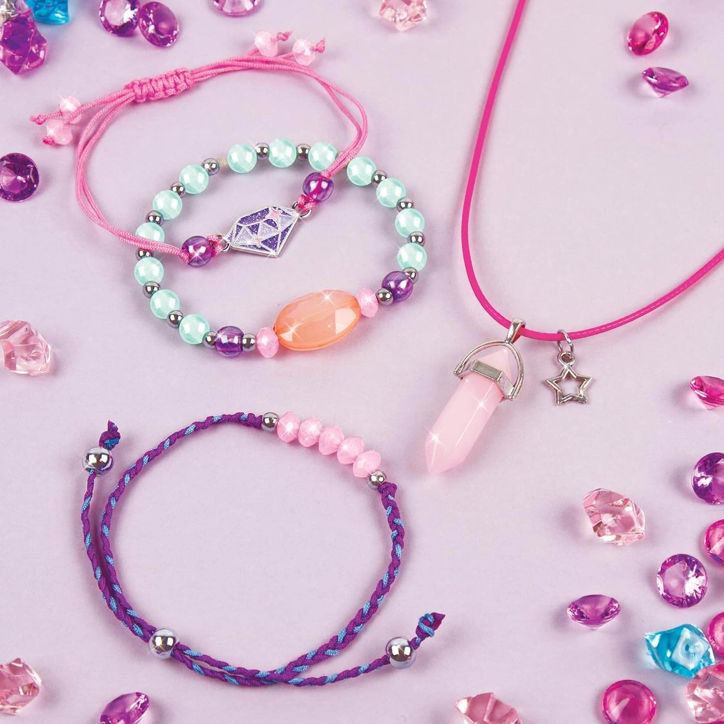 DIY jewelry kit for girls featuring colorful beaded bracelets and a pendant necklace with star charm