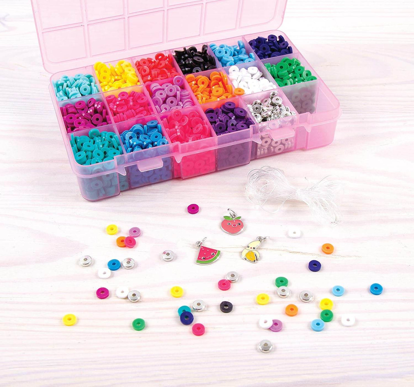Heishi bead bracelet kit with multicolored beads in a pink organizer box and assorted charms and strings