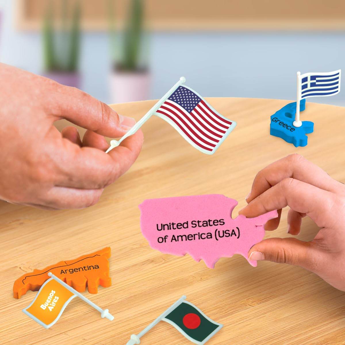 Hands holding puzzle pieces with flags and country names in Mapology world flags and capitals game