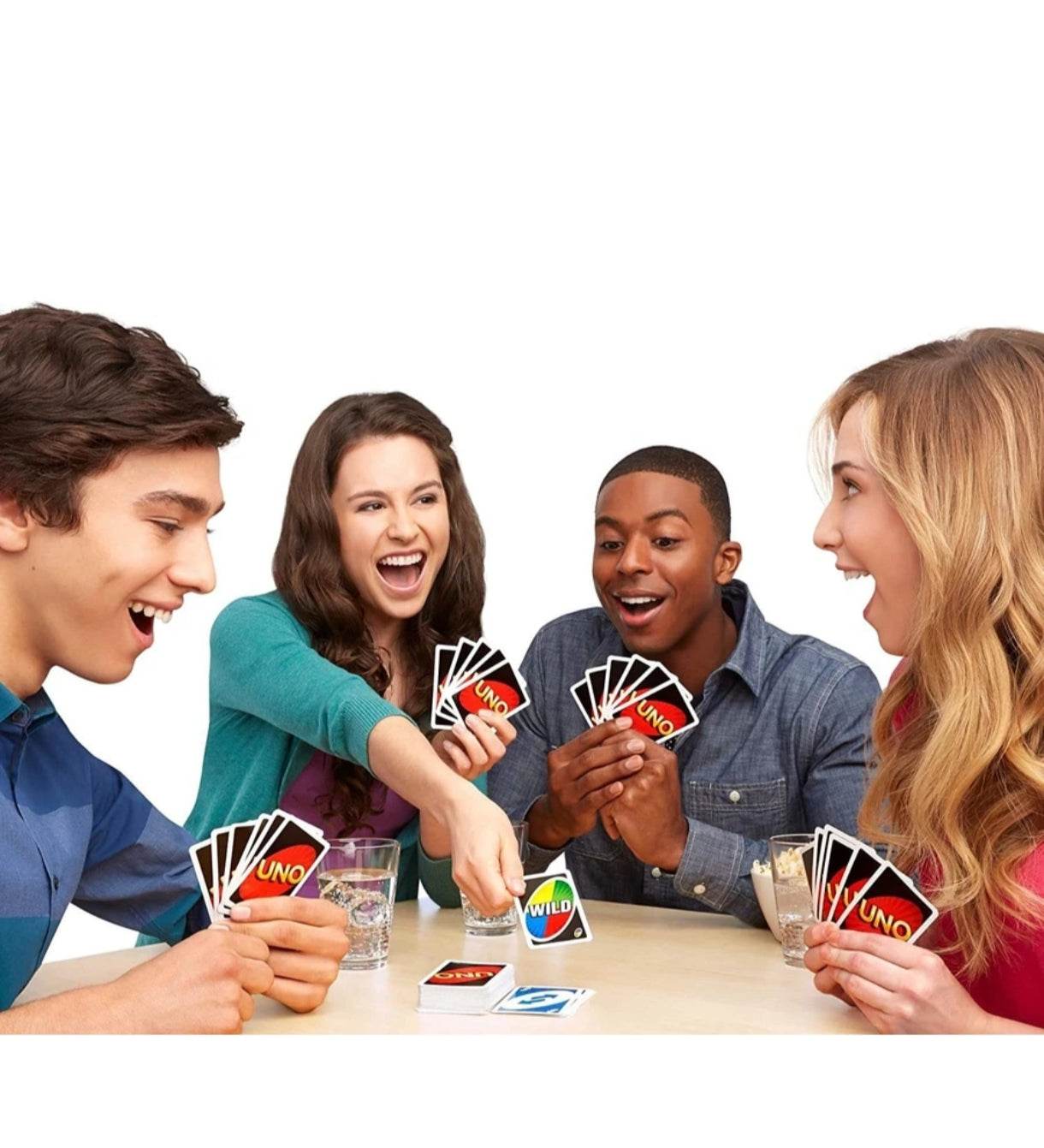 Group of young adults playing Mattel Uno card game 112 cards with colorful Uno cards on table