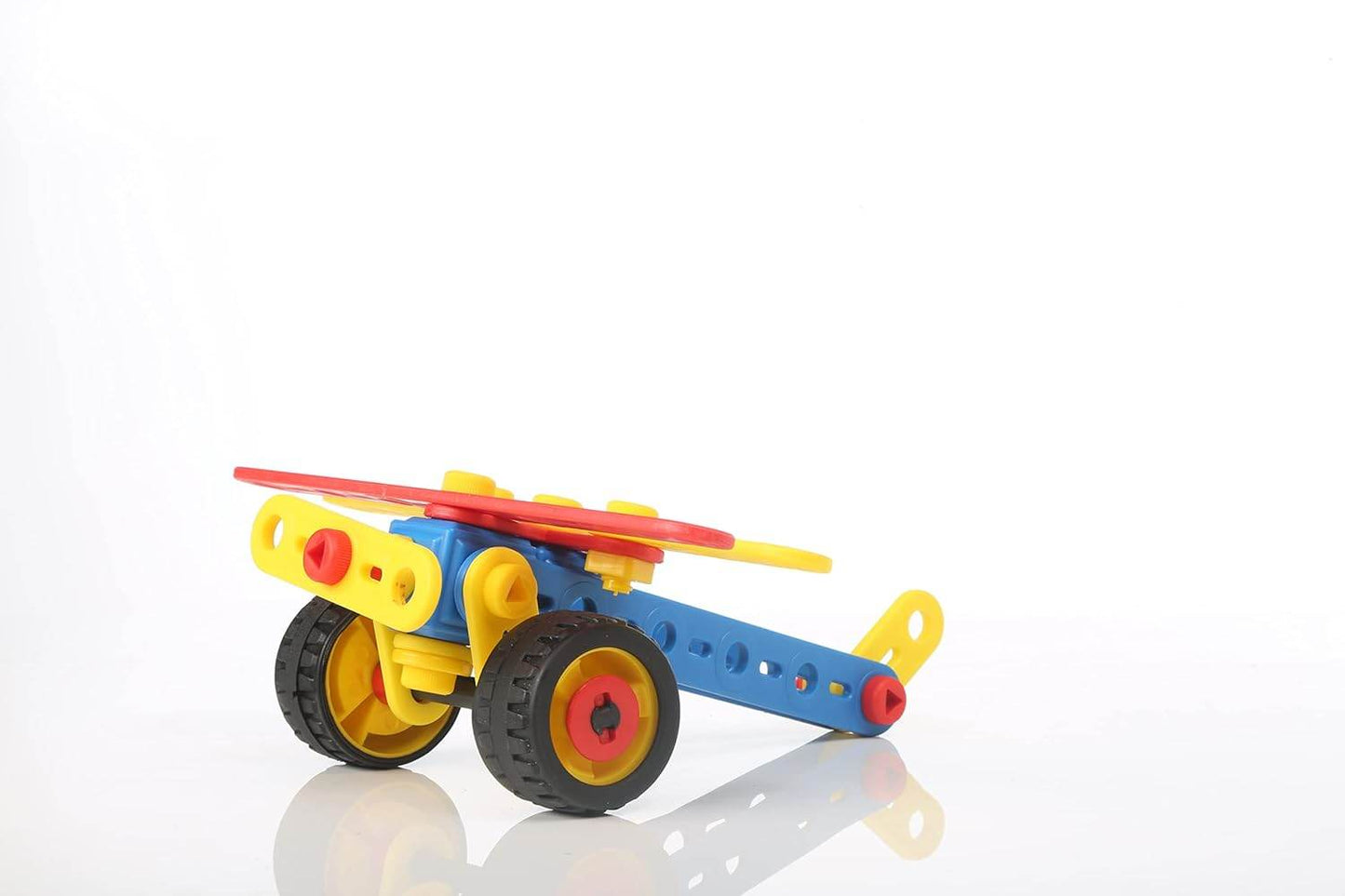 Colorful plastic construction set for children assembled into a toy vehicle with wheels
