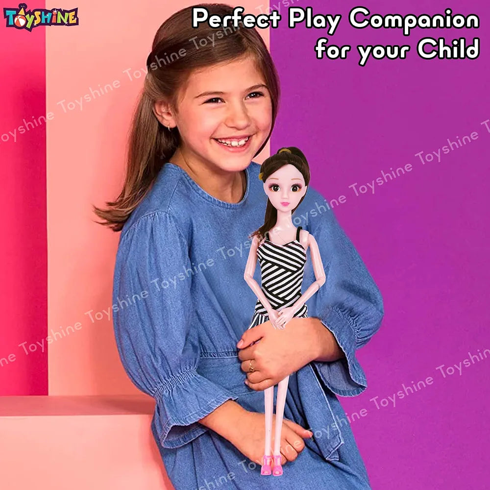 Doll in pink dress dresses held by a smiling girl wearing a blue denim dress