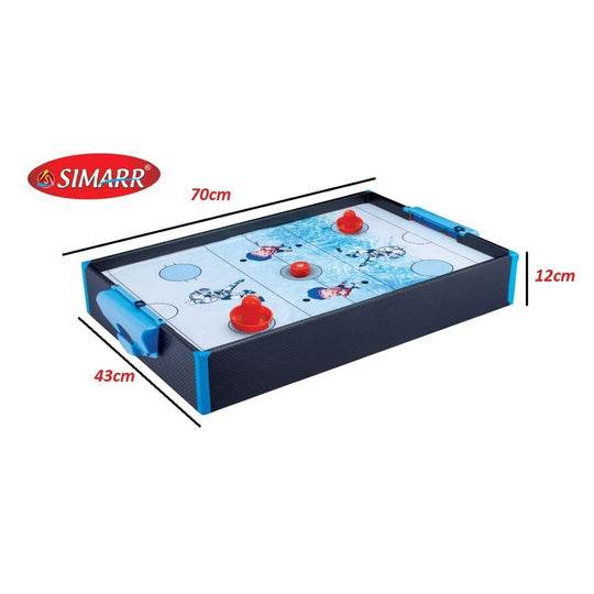 Kids air hockey table by Simarr with red paddles and puck measuring 70cm by 43cm for indoor play