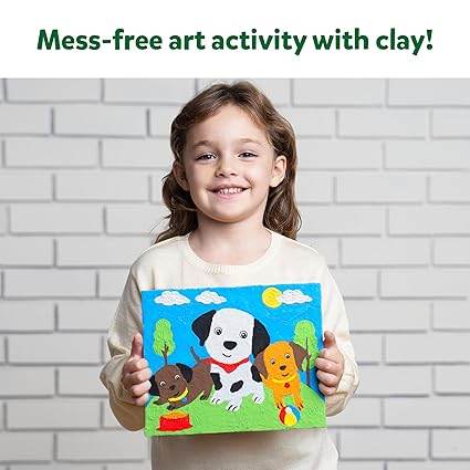 Happy child holding a colorful artwork made with colour with clay set for children featuring playful dogs