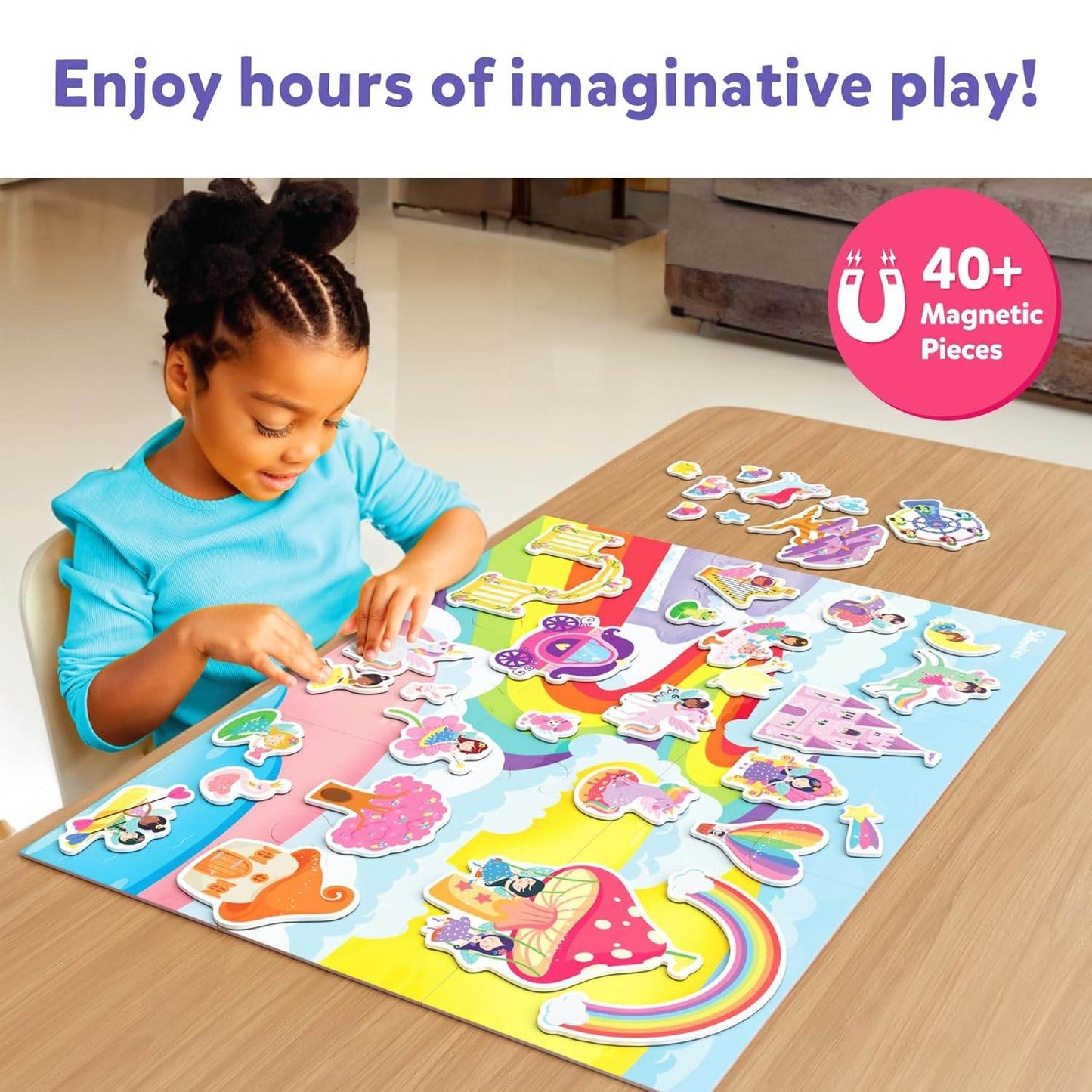 Child playing with colorful princess and unicorn toys for toddlers with 40 magnetic pieces on play mat
