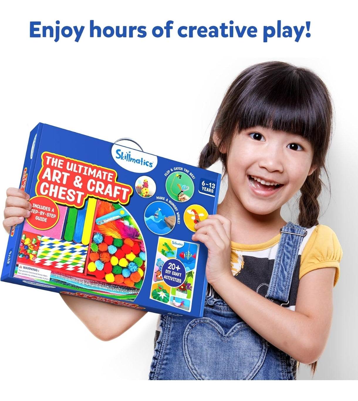 Smiling girl holding the Ultimate art and craft kit for kids with colorful materials and activity guide