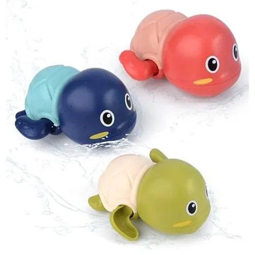 Colorful swimming turtle bath toy for toddlers in green, blue, and red floating in water