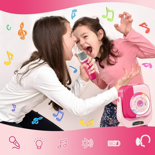 Two children playing with a pink microphone and speaker set against a pink background with musical notes.
