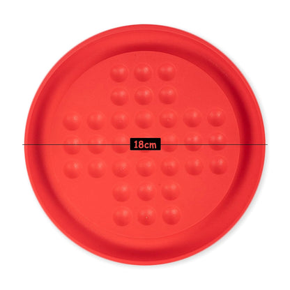 Red circular object with textured surface