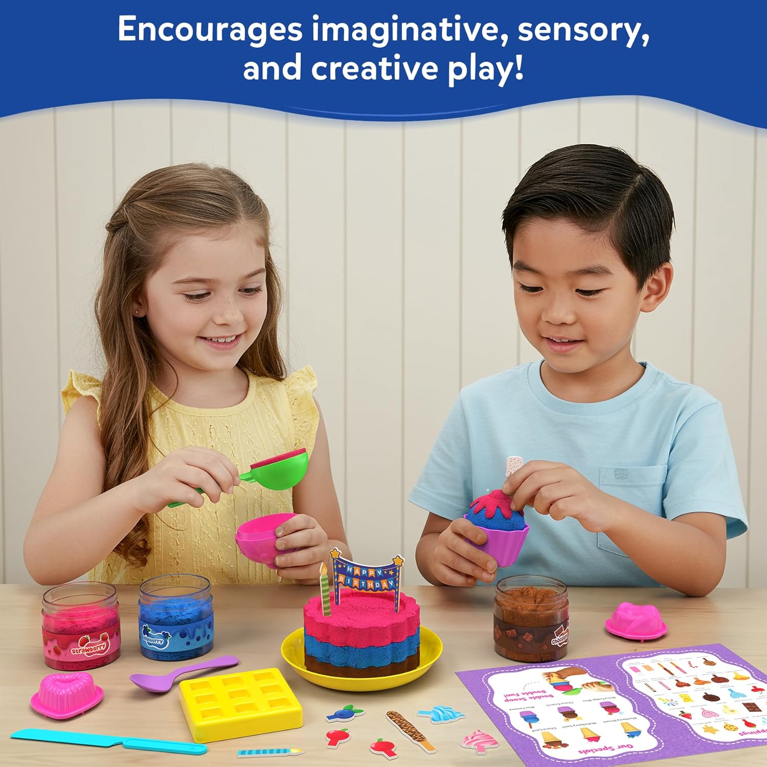 Two children playing with colorful play dough and tools on a table.