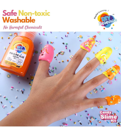 Hand with colorful slime on fingers next to a bottle of slime glue
