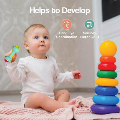 Baby holding safari rattle set for babies to develop hand eye coordination and sensory motor skills