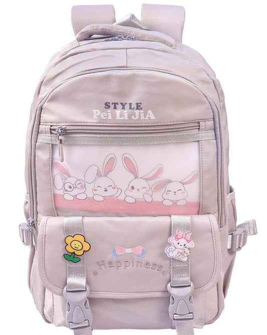 Pink backpack for school with bunny design and decorative patches