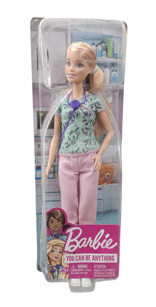 Barbie doll for kids dressed as a doctor with pink pants and medical accessories in packaging