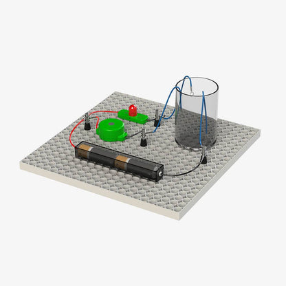 Educational construction toys for children with battery pack, wires, LED, and conductive components on a gray base