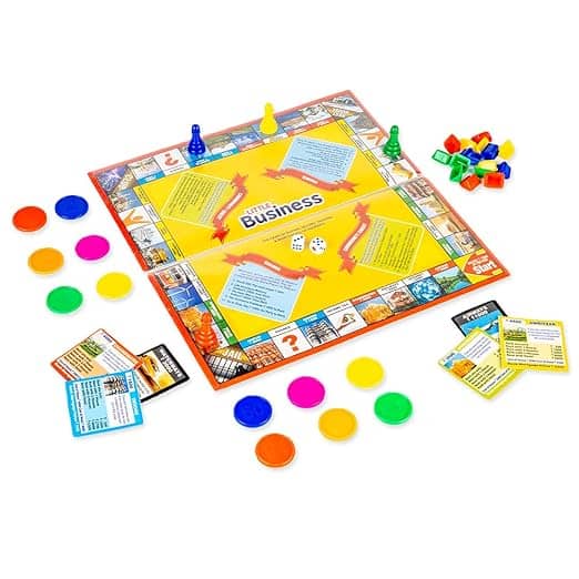 Business board game with colorful pieces and cards for ages 8 and up featuring business strike coins