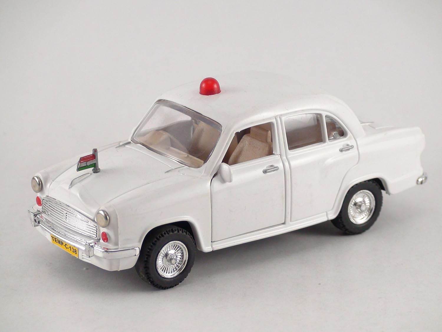 White Centy Ambassador car toy with red siren and miniature Indian flag on hood