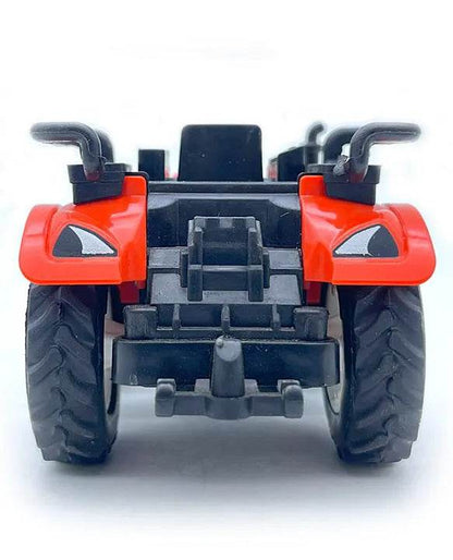 Front view of red friction powered tractor toy with black tires and detailed design