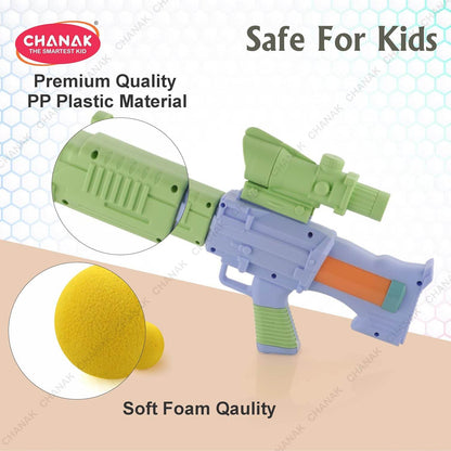 Colorful toy gun with green scope and soft foam balls for outdoor shooting games for children