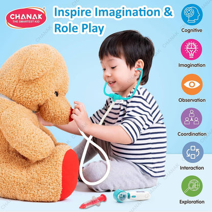 Child playing doctor with a large teddy bear, promoting pretend to play for ages 3-6 years