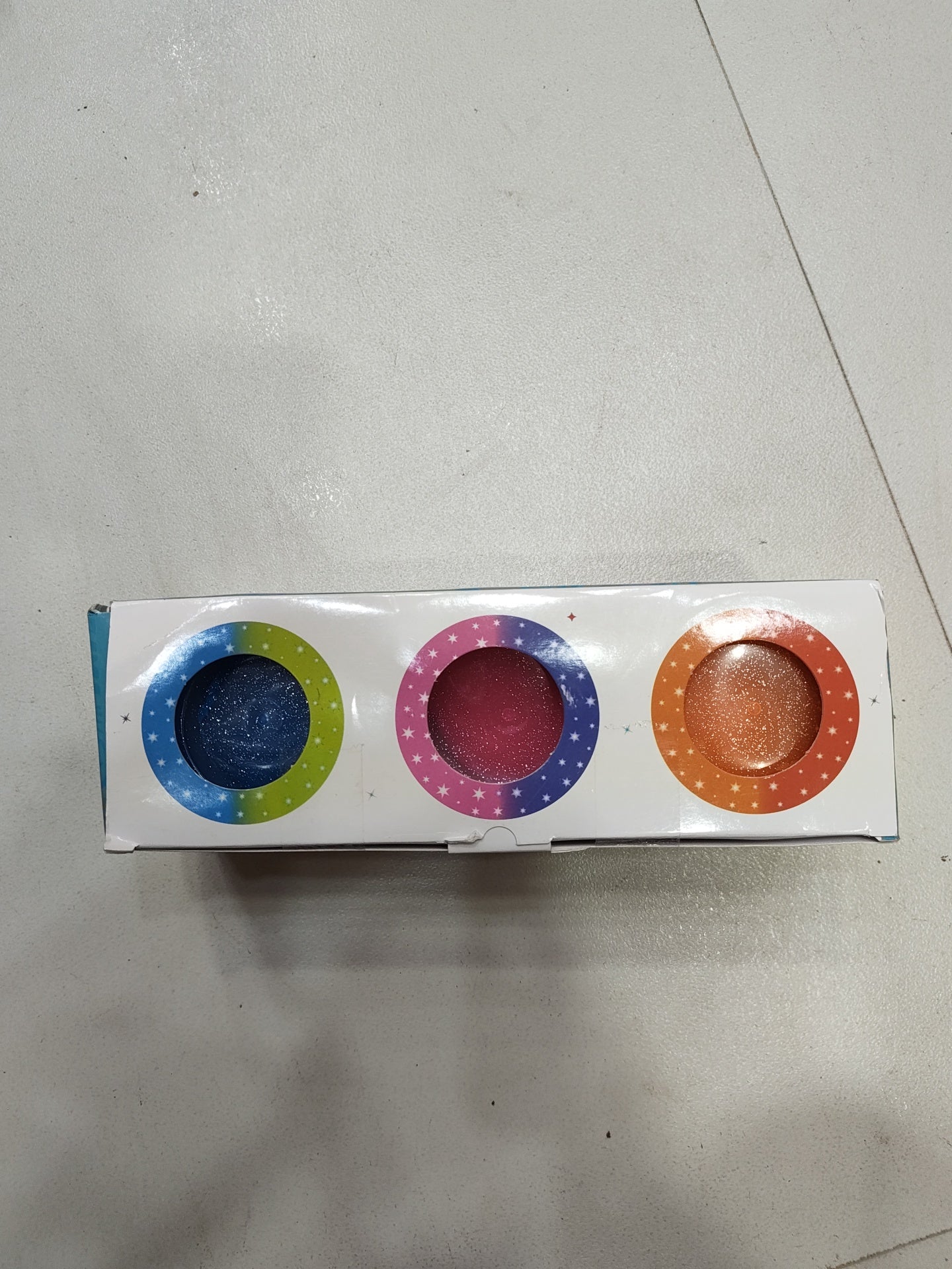 Colorful play dough set with blue, pink, and orange containers for creative fun