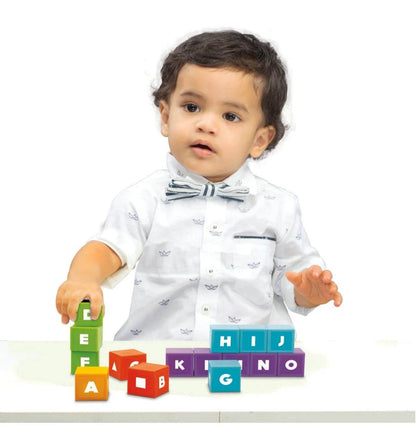 Child playing with colorful building blocks learning center for toddlers to enhance motor skills