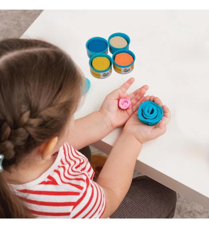 Child crafting flowers with colorful play dough in blue and pink, great for recipes play dough fun