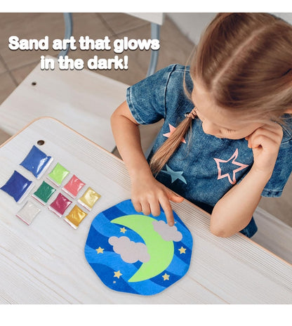 Child using Funskool Twilight Treasures DIY craft set to create glowing sand art with moon and stars design