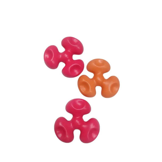 Colorful interlocking toy pieces in red and orange for creative play and skill development