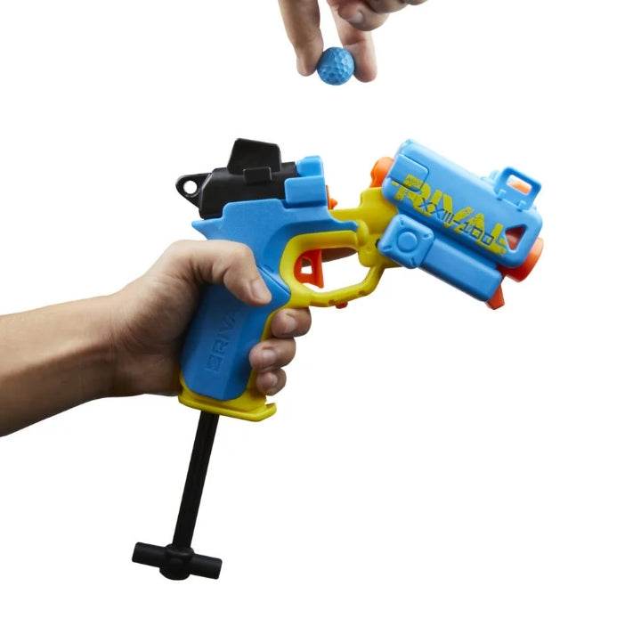 Hand holding Nerf Rival Pilot blaster toy gun with blue and yellow design loading a blue foam ball
