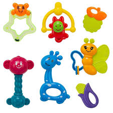 Set of colorful baby toys including a butterfly, caterpillar, and other shapes on a white background.